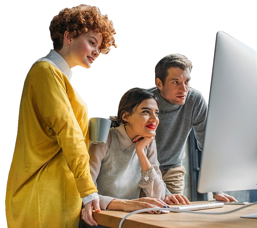 A team of three people, gathered around a large monitor.